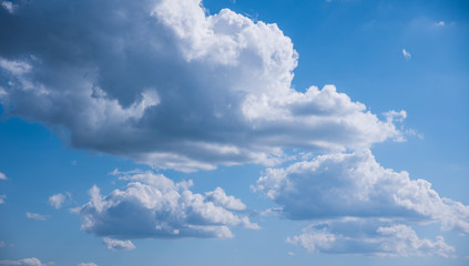 Texture of beautiful spring clouds on the background of blue clear sky