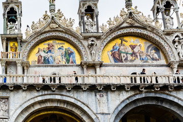 Exterior wall mosaic artwork on San Marco Basilica (Patriarchal Cathedral of Saint Mark) in Piazza San Marco (St Marks Square), Venice, Italy.