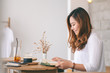 © Farknot Architect - Closeup image of a beautiful asian woman holding and reading a book while sitting in cafe
