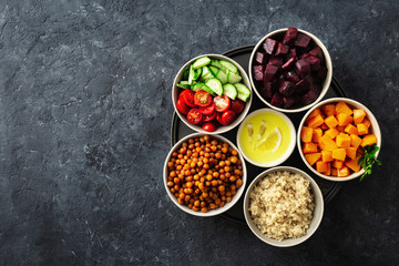 Wall Mural - Healthy vegetarian ingredients for cooking moroccan salad. Chickpeas, Baked pumpkin and beets, quinoa and vegetables top view copy space