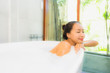 © siraphol - Portrait beautiful young asian woman in the bathtub for take a bath