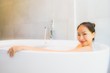 © siraphol - Portrait beautiful young asian woman in the bathtub for take a bath