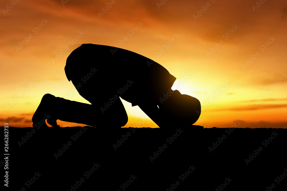 Silhouette of muslim man praying Stock Photo | Adobe Stock