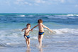 © Irina Schmidt - Two kid boys running on ocean beach. Little children having fun