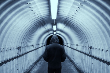 Poster - Silhouette of man standing at end of tunnel