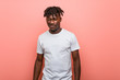 © Asier - Young african black man winking, funny, friendly and carefree.