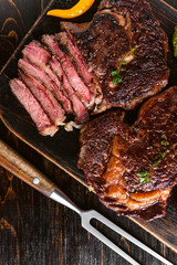 Dinner for two juicy delicious steaks, asparagus with parmesan and vegetables.