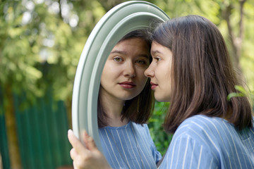 Girl looking in mirror