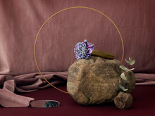 Rock With Dusty Rose Backdrop And Orange Ring