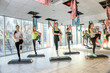 © RomanR - Group of women in gym making balancing exercises