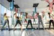 © RomanR - Healthy, young group of women doing exercises in gym