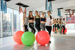 © RomanR - Group of young women in gym with fitness balls