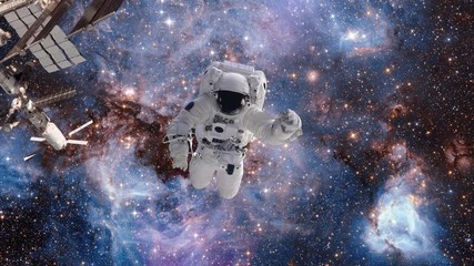 astronaut in outer space against the background of a galaxy