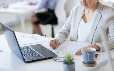 Poster - business and people concept - businesswoman with papers working at office