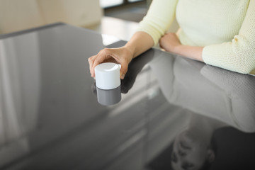 Poster - technology and people concept - close up of woman using smart speaker on black interactive panel