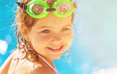 Poster - Beautiful little girl sunning at the pool