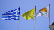 Fluttering In Wind Flags Of Cyprus And Greece Against Blue Sky, Slow Motion
