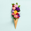 Leinwandbild Motiv Ice cream cone with flowers and leaves. Summer minimal concept.