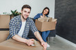 © Тарас Нагирняк - Happy young couple packing cardboard boxes during relocation!  New apartament! Lifestyle!