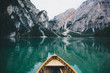 © Jake Elko/Stocksy - Boat On Italian Alpine Lake Reflection