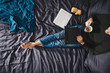 © Lumina/Stocksy - A Man Sitting on KIng-Size Bed and Using Laptop