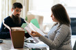 © Sean Locke Photography/Stocksy - Taxes: Couple Going Through Tax Return Information