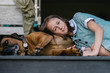 © Gillian Vann/Stocksy - cute moment with young teen and her dog