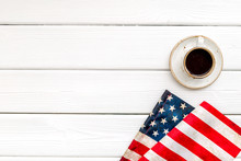 USA National Day Background With Flag And Cup Of Coffee On White Wooden Desk Top View Copy Space