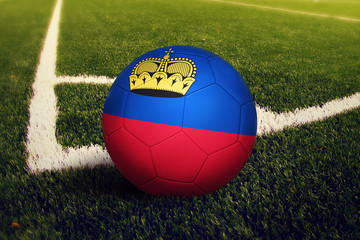 Liechtenstein ball on corner kick position, soccer field background. National football theme on green grass.