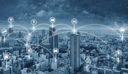 Wall Mural - Smart city and internet wireless and networking in the city. Futuristic city with internet network and online media application icons