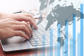 Wall Mural - Global business analytics. Businessman analyzing data.Growth graph, world map and laptop.