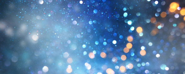 glitter vintage lights background. black silver and blue. de-focused