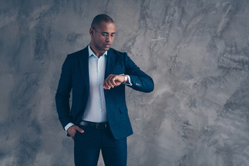 Wall Mural - Portrait of attractive charming entrepreneur ceo short hair baldmeeting see wait time feel focused impatient have briefing wrist watch wear modern blazer outfit isolated on dark grey background  