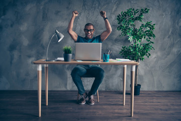 Wall Mural - Full length body size photo amazing he him his handsome first earned salary notebook table lamp light green plant reliable person wear specs blue t-shirt pants sit chair indoors workstation office