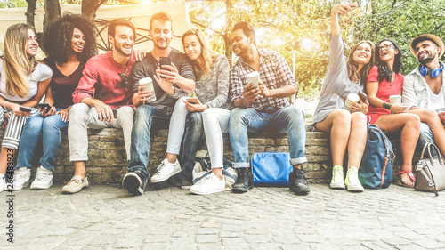 Fotomural Group of happy friends using smartphones for taking photos and watching videos -