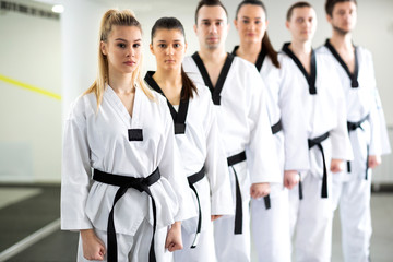 Group of lined up martial artists