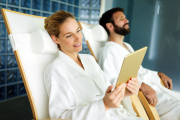 Wall Mural - Attractive happy couple relaxing in spa center