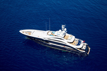 Wall Mural - luxury motor yacht in the sea top view from a helicopter