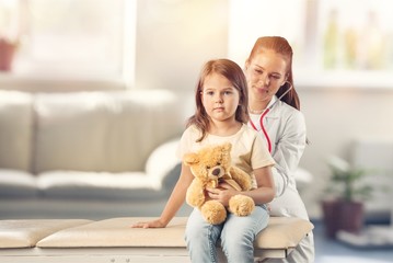 Canvas Print - Doctor vaccinating little girl isolated on a white background