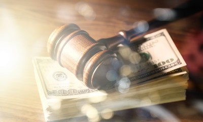 Wall Mural - Wooden gavel on wooden table and money , on  background