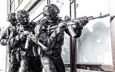 Wall Mural - police counter terrorist team squad storming building