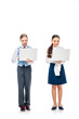 © LIGHTFIELD STUDIOS - smiling schoolgirls in formal wear using laptops On White