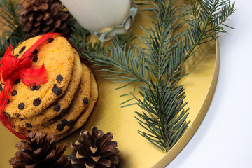 A glass of milk and cookies for Santa. Christmas Eve Concept.