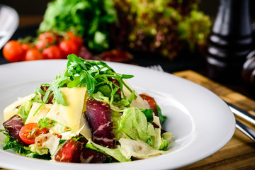 Wall Mural - Salad with baked beet, blue cheese, ham and green mix with pesto