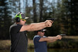© Daniel Teetor - Two men training with handguns.