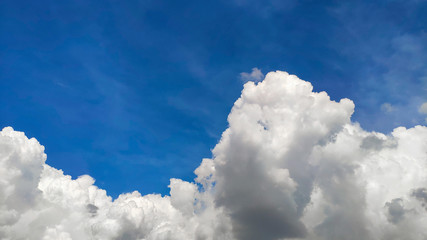 Beautiful blue sky and large white cumulus clouds, soft focus, background