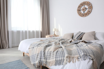 Sticker - Bed with pillows and plaid in modern room interior