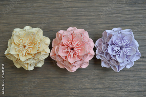 Yellow Pink And Purple Origami Kusudama Flower On Wooden