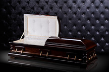 Opened Wooden Brown Sarcophagus Isolated On Gray Luxury Background. Casket, Coffin On Royal Background.