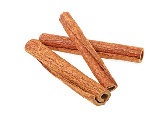 Three cinnamon sticks isolated on a white background. Full depth of field.